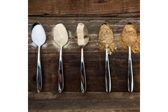 Image Five spoons with different sweeteners are placed next to each other.